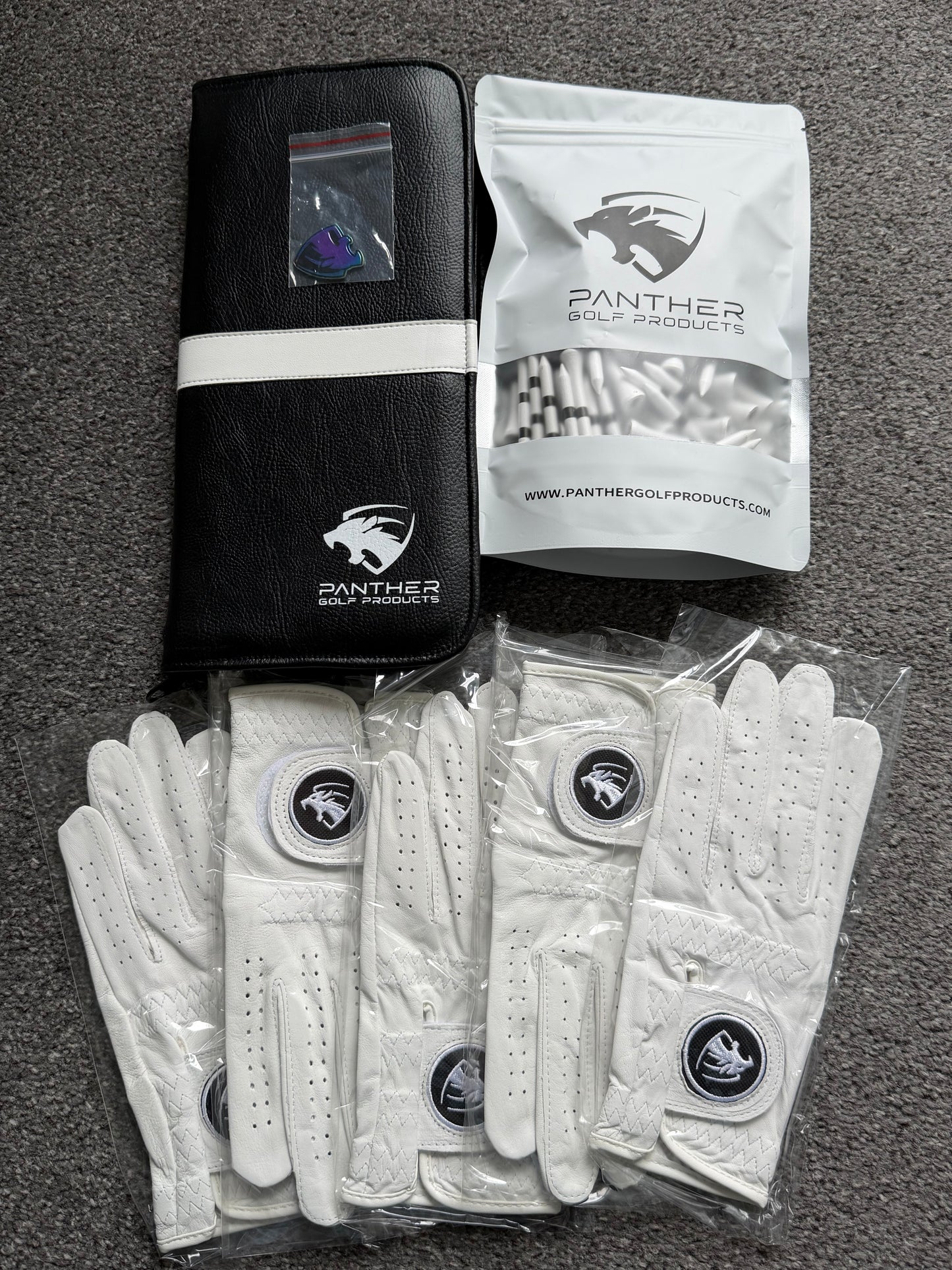 Golf Glove Caddie & 5 Panther Gloves And 1 Bag Of Tees And A Random Ball Marker